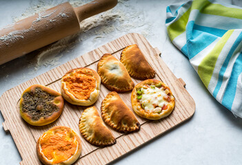 Assorted Arabic mini pastry served in board isolated on table top view of arabic food