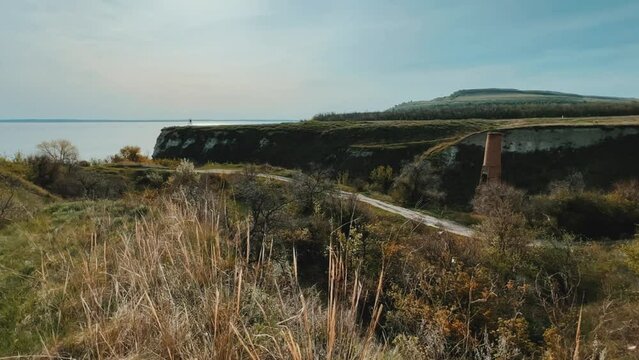 An abandoned dilapidated red brick oven. Saratov region, Russia. An ancient lime kiln on the banks of the Volga River. Stepan Razin's Rock. 4K