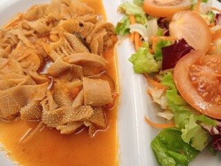 typical dish of Roman cuisine, the heart of Italy, tripe, which is offal used in gastronomy and...