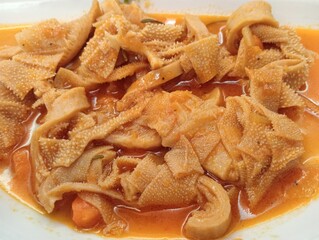 typical dish of Roman cuisine, the heart of Italy, tripe, which is offal used in gastronomy and...