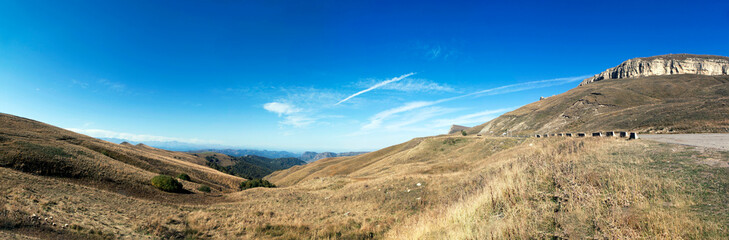 A picturesque view of the Biychesyn plateau and the Caucasus ridge from the Marinsky pass or Gumbashi pass (Gum-Bashi, Kum-Bashi) height 2187 meters. Karachay-Cherkessia. Russia