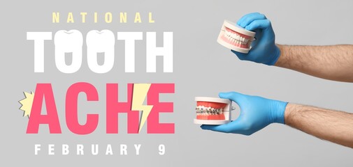 Banner for National Toothache Day with dentist's holding models of jaw