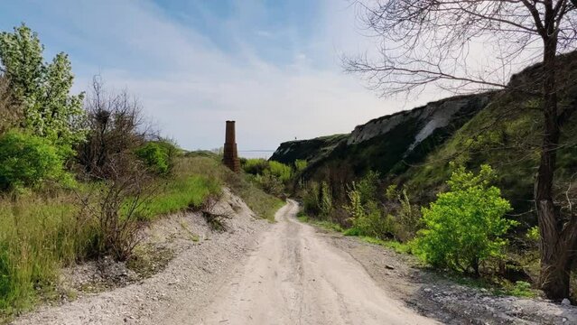 An abandoned dilapidated red brick oven. Saratov region, Russia. An ancient lime kiln on the banks of the Volga River. Stepan Razin's Rock. 4K