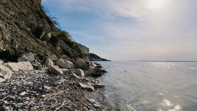 Beautiful summer view of Stepan Razin Rock on the Volga River, Saratov region, Russia. An amazing landscape with blue sky, steep cliffs and picturesque mountains with a white road. 4K