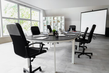 Interior of conference room with desk and shelf unit