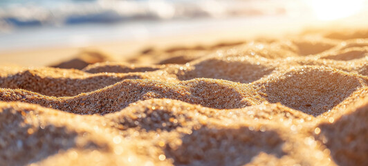 Fototapeta na wymiar Golden Sunrise Light on Sandy Beach