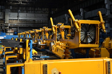 Crawler bulldozer assembly line. Spare parts for assembly on the production line. Heavy industry. Construction equipment.