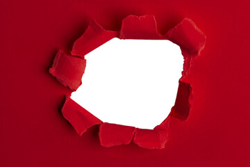 Red thick paper, torn in the middle with an empty hole. And an empty background behind