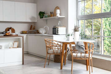 Dining table with dried lavender in interior of modern kitchen