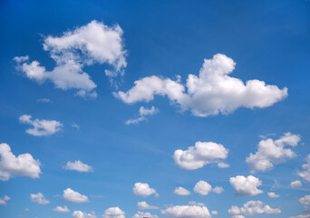 white clouds against a blue sky. Beautiful daylight natural sky composition. heavenly light