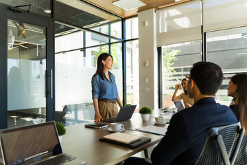 Businesswoman joking around during a business presentation