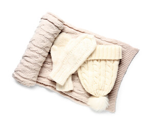 Pair of knitted mittens with warm hat and scarf on white background