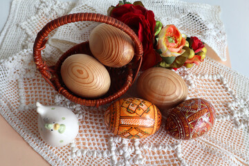 Fototapeta na wymiar Background with hand crafted wooden easter eggs (pysanka) from Ukraine