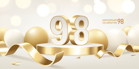 98th Anniversary celebration background. Golden 3D numbers on round podium with golden ribbons and balloons with bokeh lights in background.