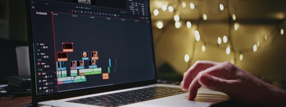 Video editing on a laptop. Monitor the computer the work of the interface program for video editing: the fragments are connected timeline. Video or sound processing, postproduction, film maker