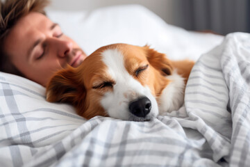 owner sleeping delight in bed with his dog