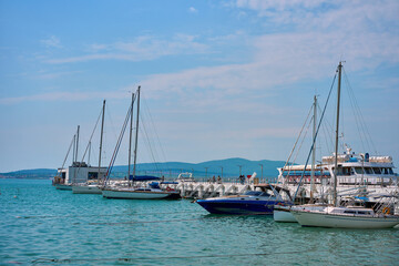 sailing yacht floats in the sea near the shore