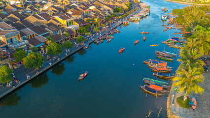 Aerial drone view of Hoi An city during a sunset in Vietnam. Ancient town, UNESCO world heritage,...