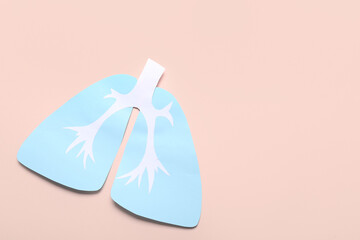 Paper lungs on beige background
