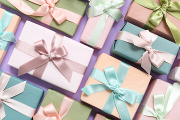 Many gift boxes on lilac background. International Women's Day