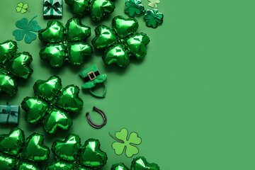 Balloons in shape of clover, leprechaun's hat and horseshoe on green background. St. Patrick's Day...