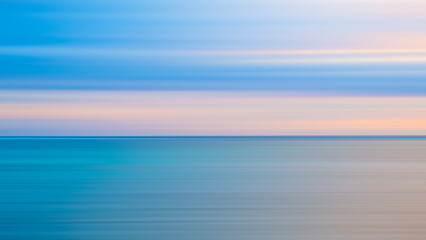 Abstract background of blue sea wave Motion blur sea water and beautiful sunset with clouds