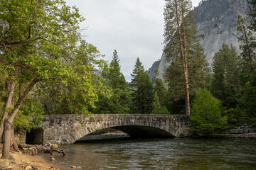 Fototapeta na wymiar Bridge Over Merced River During Flood Season in Yosemite