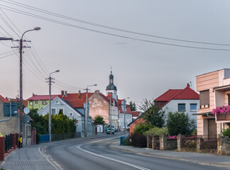 Green summer cityscape of Bnin, small town near Kórnik (Kornik), Poznan, Wielkopolska, Poland at sunset - obrazy, fototapety, plakaty