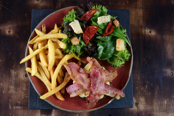 beef burger with bacon fries and salad fast food