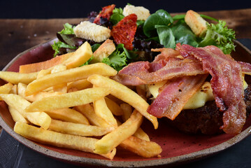 beef burger with bacon fries and salad fast food
