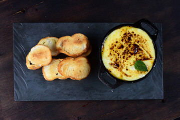 meatballs covered with sauce and melted cheese and salad