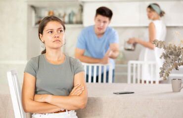 Girl listens to swearing and accusations of inappropriate behavior from mother and brother. Girl...