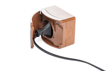 Black power cable connected to brown isolated on white background, close -up. (selective focus)