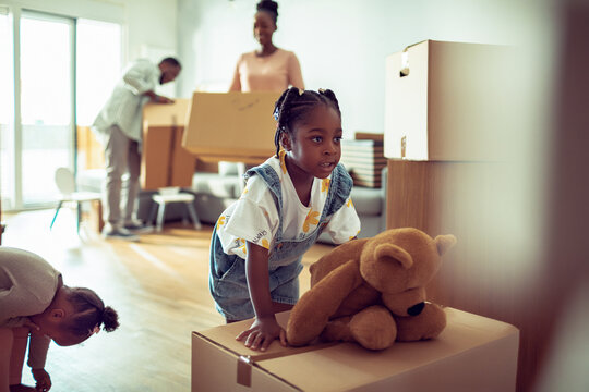 Young african family moving in their new home apartment