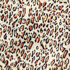 Seamless texture photo of leopard patterned cloth material.