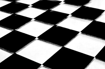 Black and white checkerboard background with raised diamonds
