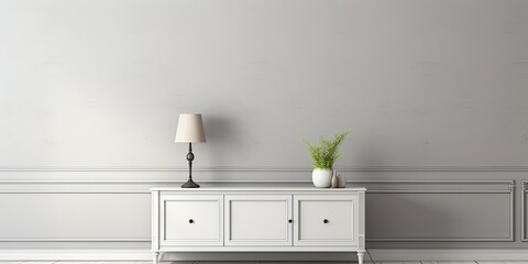 Contemporary dresser with nearby lamp by gray room wall.