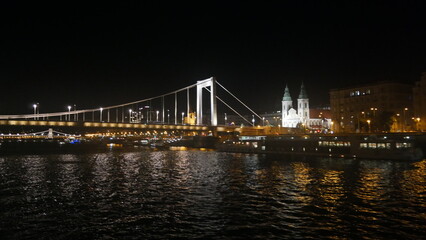 Fototapeta na wymiar Hungary Budapest night sailing and view of Buildings infrastructures bridges landmarks in the city along Rhine river and Danube river 