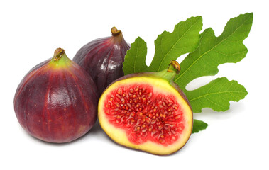 Figs whole and half with leaves isolated on white background