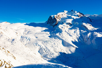 Winter landscape of picturesque mountain peaks located near the resort village of Zermatt, Switzerland