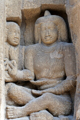 Bas relief of Hindu deity Sandstone sculpture. Ruins of ancient sculptures carved in the walls of Kanchi Kailasanathar temple in Kanchipuram, Tamilnadu.