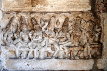 Bas relief of Hindu deity Sandstone sculpture. Ruins of ancient sculptures carved in the walls of Kanchi Kailasanathar temple in Kanchipuram, Tamilnadu.