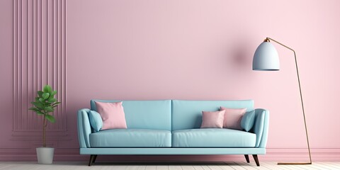 Living room with blue sofa, rug and lamp in light pink hue.