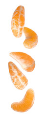 Pieces of fresh ripe tangerine falling on white background