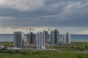 Obraz premium construction of a residential complex near the Mediterranean Sea in winter in Cyprus 1