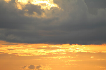 sunset in the sky. sunset in the clouds. sunset over the clouds. orange sky at sunset.