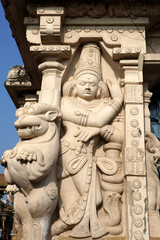 Sandstone sculpture of Hindu God with Lion carved in the walls of ancient Kanchi Kailasanathar temple in Kanchipuram, Tamilnadu.