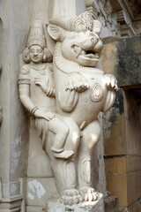 Fototapeta na wymiar Sandstone sculpture of Hindu God with Lion carved in the walls of ancient Kanchi Kailasanathar temple in Kanchipuram, Tamilnadu.