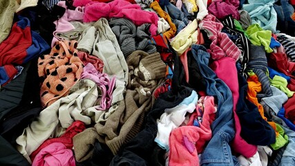 Clothes, footwear and household textiles are responsible for water pollution, greenhouse gas emissions and landfill. - obrazy, fototapety, plakaty