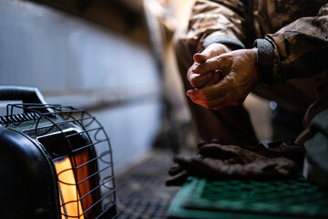 Warming hands in a duck blind
